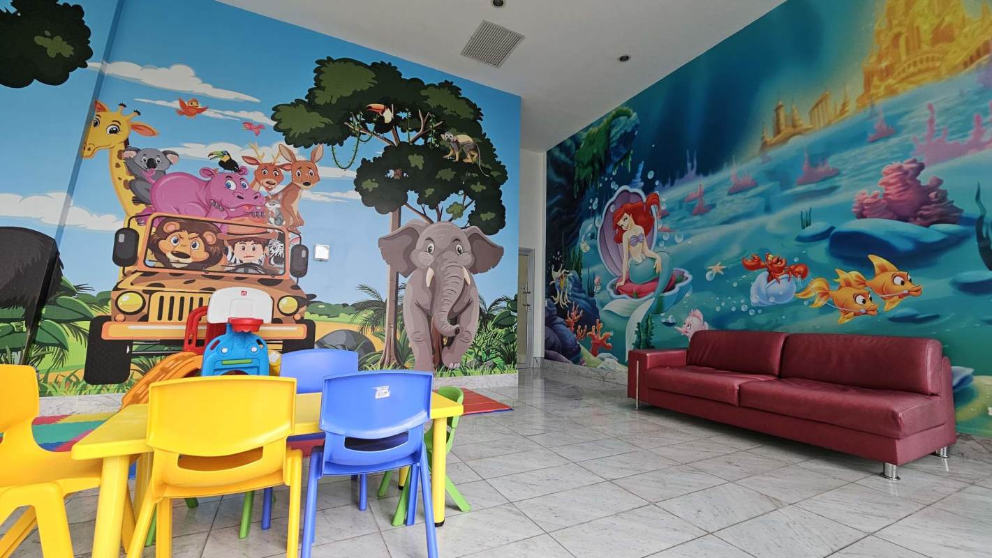 Colorful children’s playroom with murals in PH Waters On The Bay Panama City