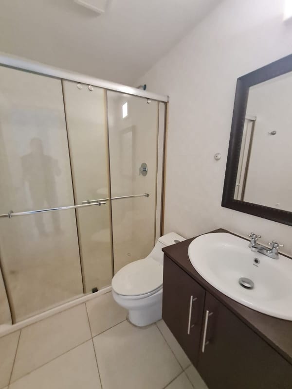 Contemporary bathroom with glass shower and vanity in PH Waters Panama