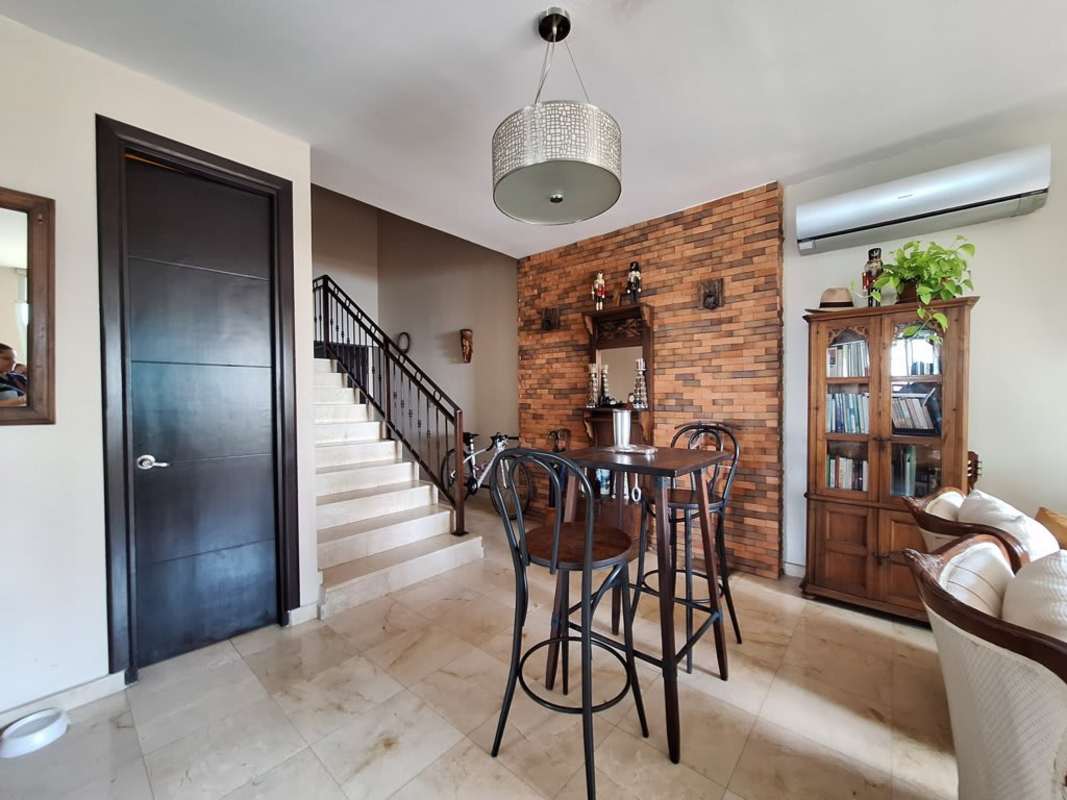 Open living room with access to large balcony city views PH Costa Pacifica Panama