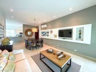 Stylish living room with glass doors to patio contemporary furniture Punta Barco Panama