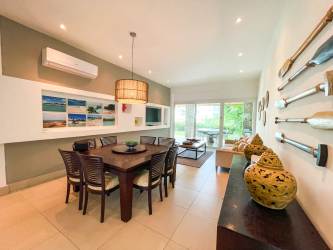 Open plan dining connected to modern kitchen coastal style Punta Barco Panama condo for sale