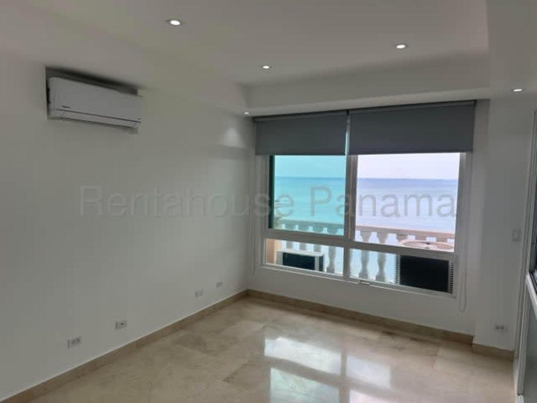 Large living room with floor-to-ceiling windows and ocean view in PH BICSA Tower Panama City