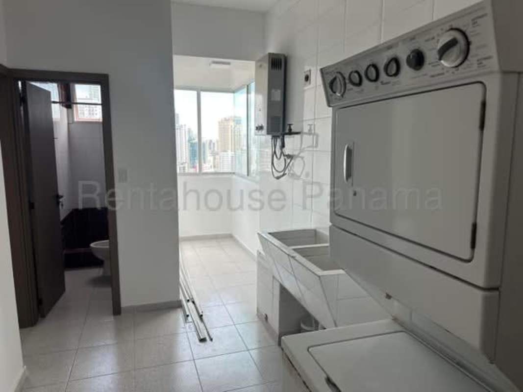 Remodeled kitchen quartz countertops built-in appliances at PH BICSA Tower Panama City