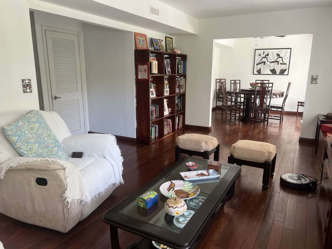 Spacious master bedroom with garden view and wood floor in rental Clayton house Panama