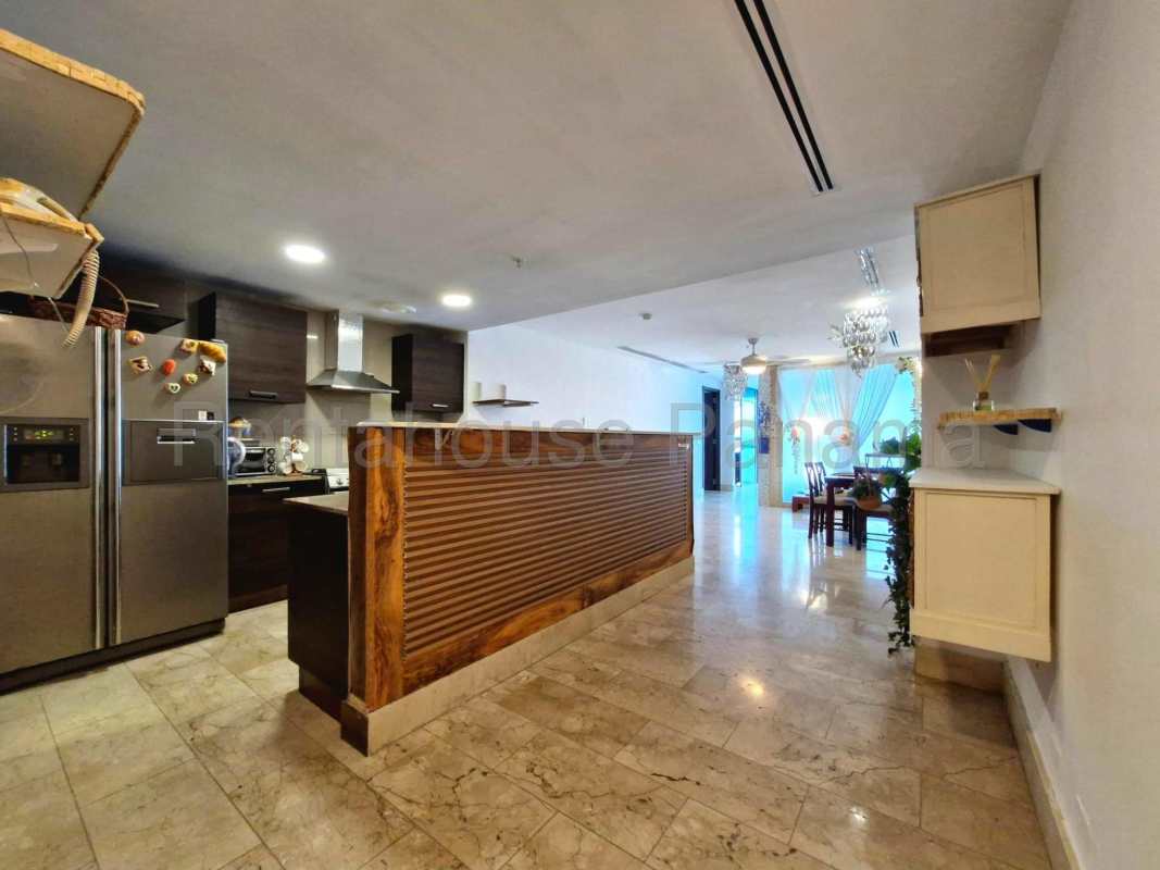 Contemporary living area with large windows, balcony to ocean view PH Pacific Point Panama City