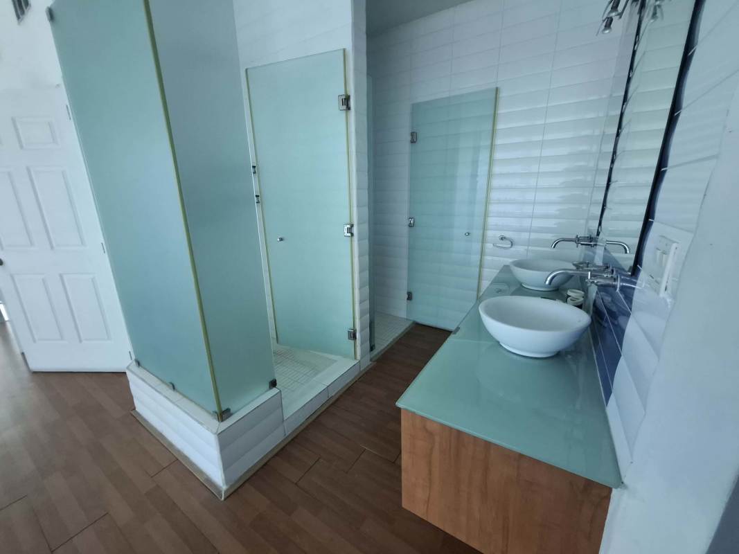 Spacious furnished loft bedroom with floor-to-ceiling windows city view PH Loft 41 Punta Pacífica