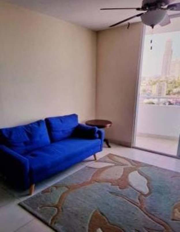 Furnished living room with balcony access and city views in Panama City Edison Park