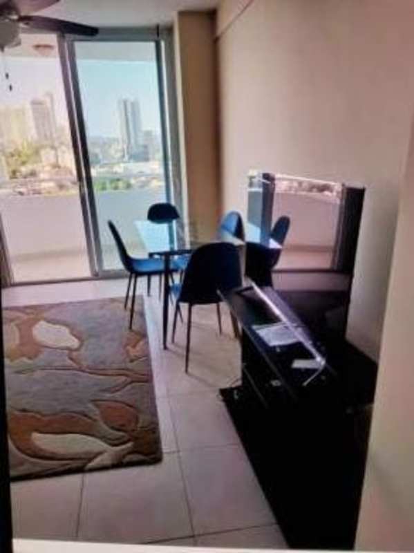 Living room area with sofa, kitchen breakfast bar and ceiling fan PH El Mare 500