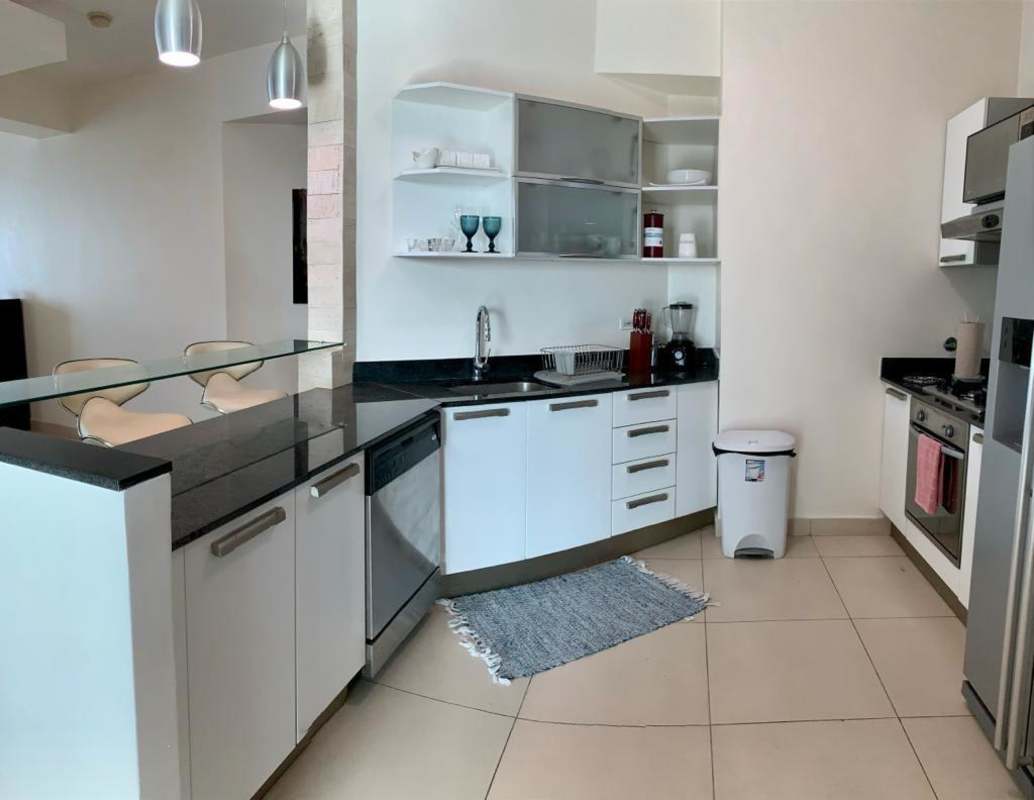 Fully equipped modern kitchen with granite countertops and stainless appliances in PH Destiny Tower Panama