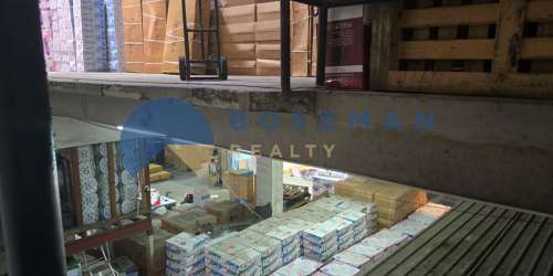 Warehouse with stacked boxes and industrial shelving in Free Zone Panama