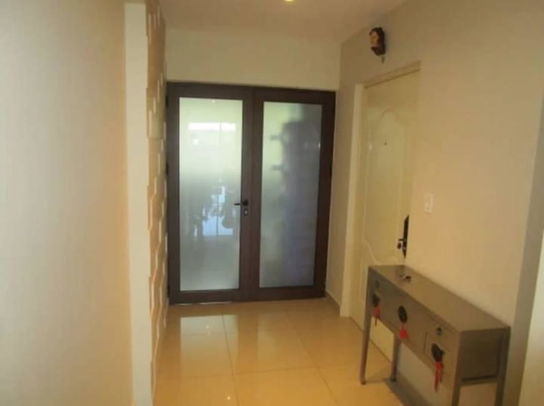 Spacious open-plan living dining room with balcony access at PH Altavista Clayton Panama City