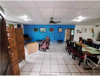 Covered patio terrace with hammocks dining seating tropical garden beach house Panama