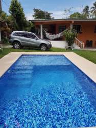 Bedroom with double bed bunk beds split AC vibrant curtains vacation rental Panama