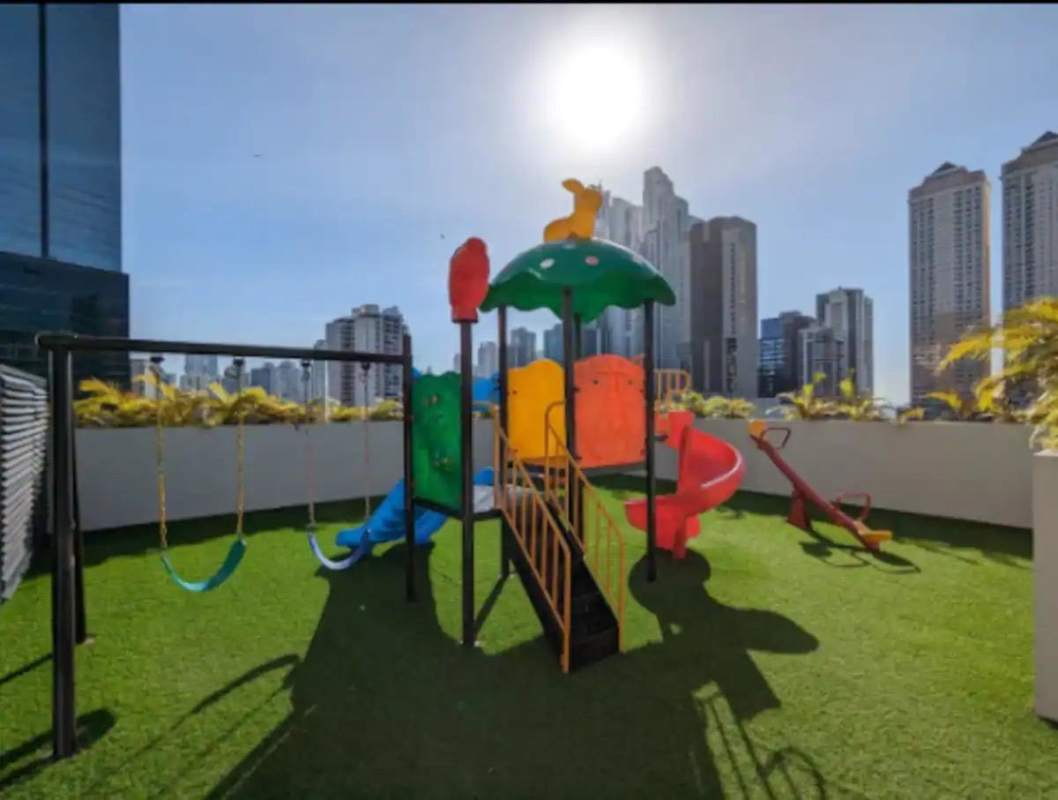 Children's rooftop playground with city skyline view PH The Gray Bella Vista Panama