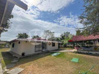 Single story beach home Playa Gorgona with front patio large lawn mature trees Panama for sale