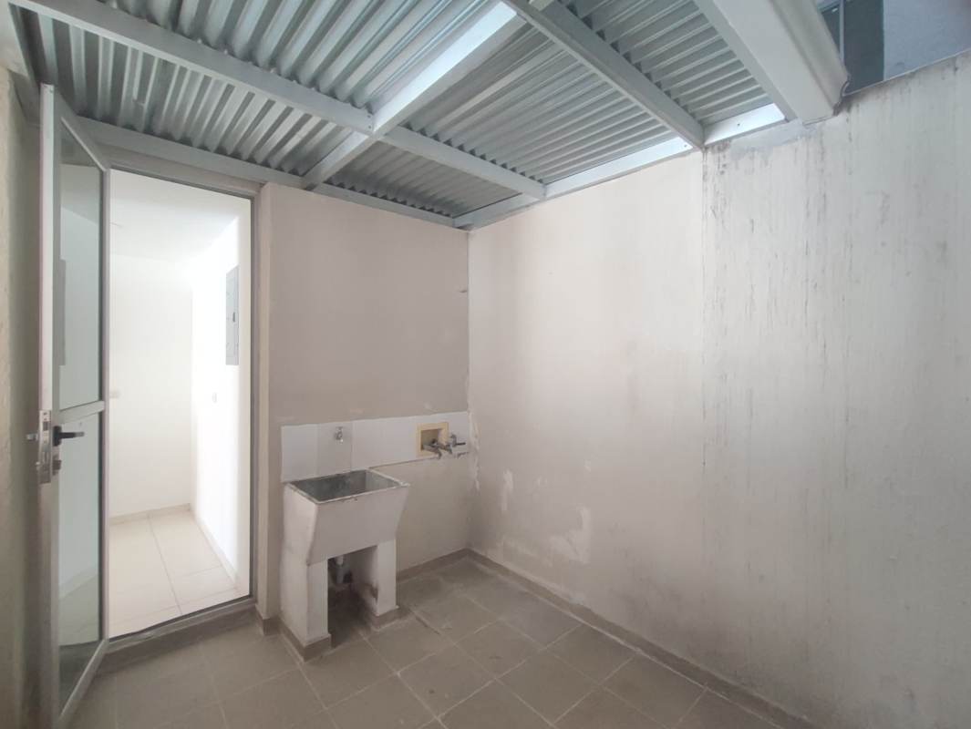 Covered laundry with utility sink corrugated roof and plumbing PH Altavista Tower Panama City