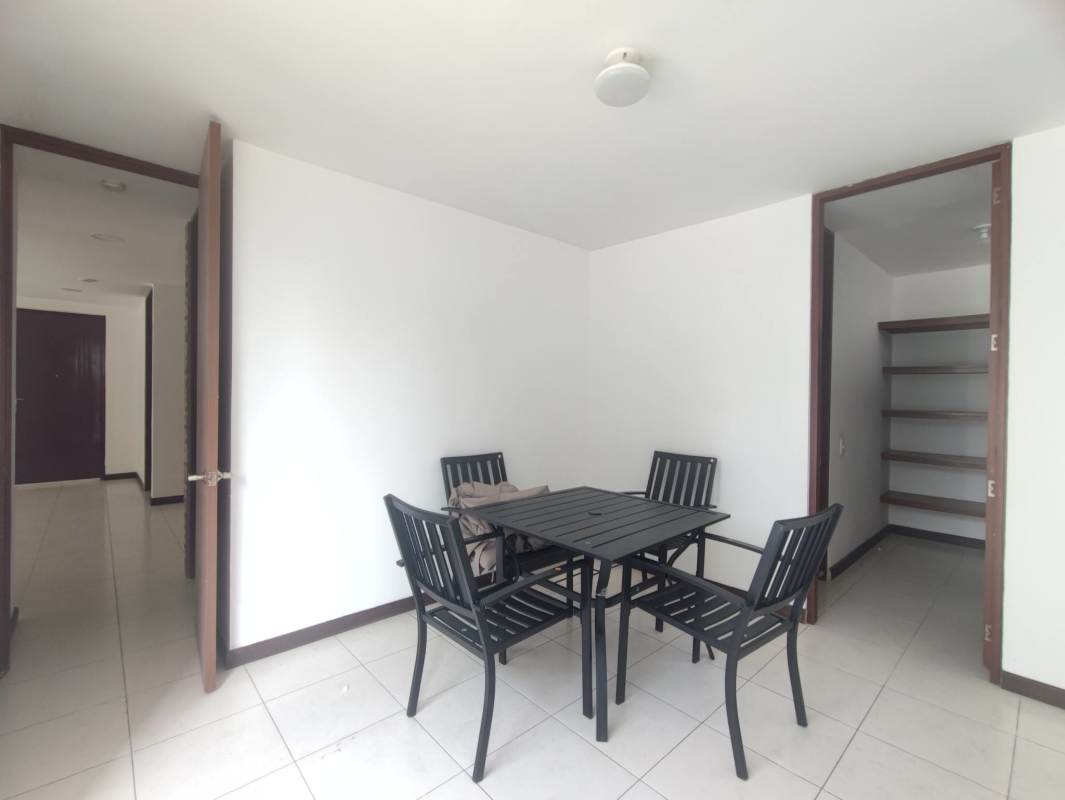 Walk-in closet with built-in shelving and rods ceramic floor Altavista Tower Panama City