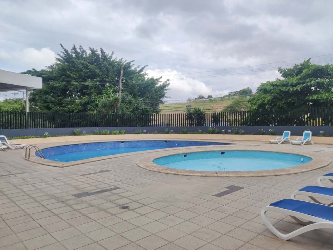 Outdoor swimming pool with decking lounge chairs PH Altavista Tower Panama City