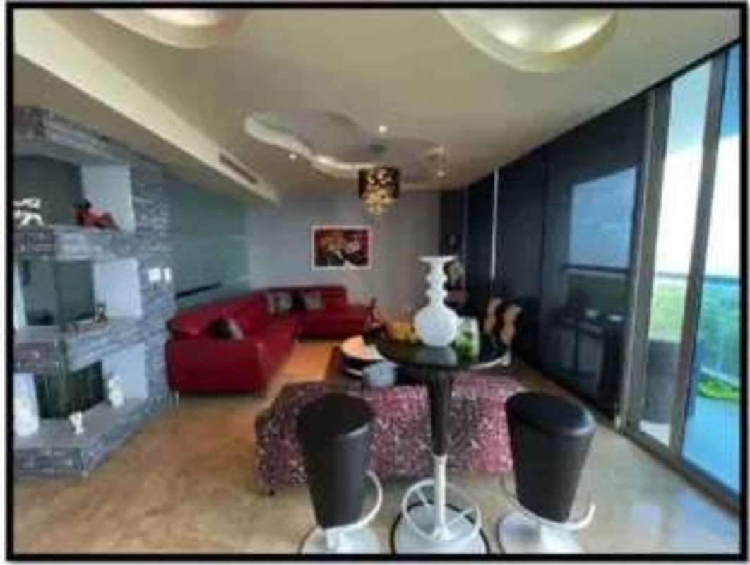 Spacious living room with panoramic ocean view windows in PH Pearl at the Sea Costa del Este Panama