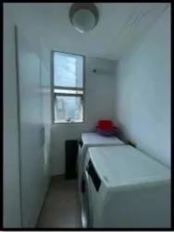 Laundry area with built-in cabinets and appliances in PH Pearl at the Sea Panama