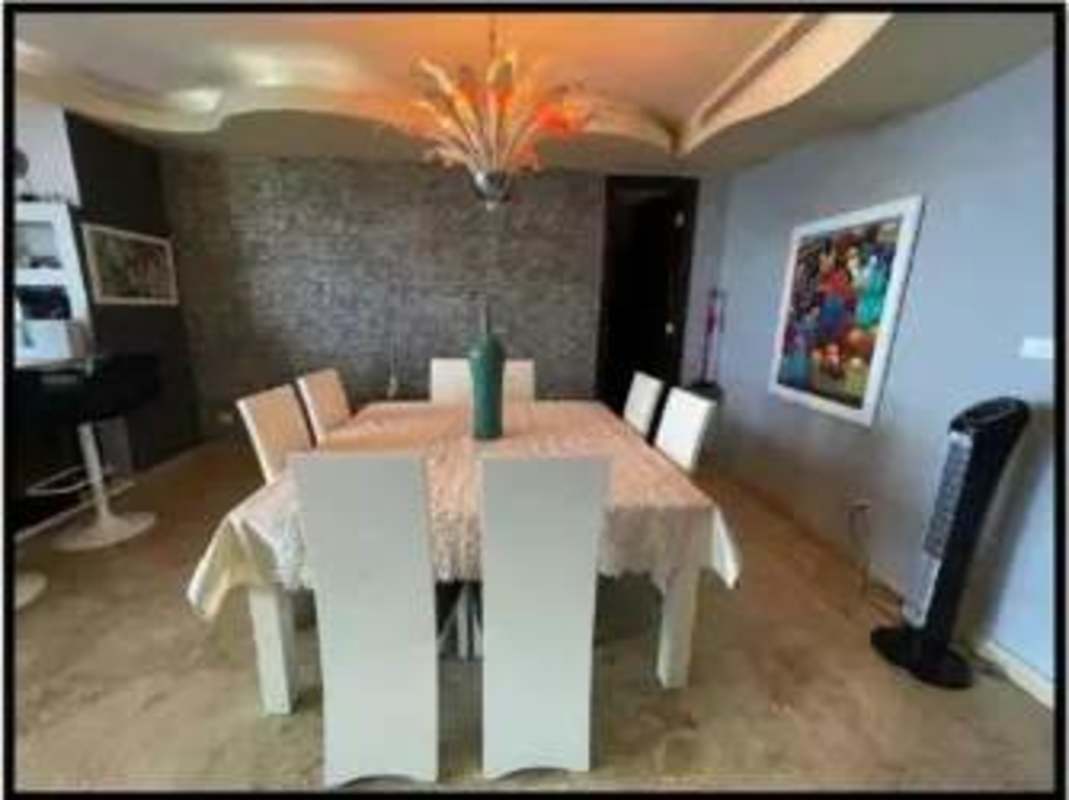 Spacious contemporary dining room with designer lighting at Pearl at the Sea Costa del Este Panama