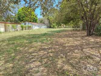 Fenced grassy empty lot ideal for house construction Playa Coronado Panama
