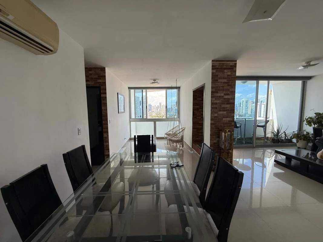 Open dining living area large windows city skyline Infinity Tower Panama