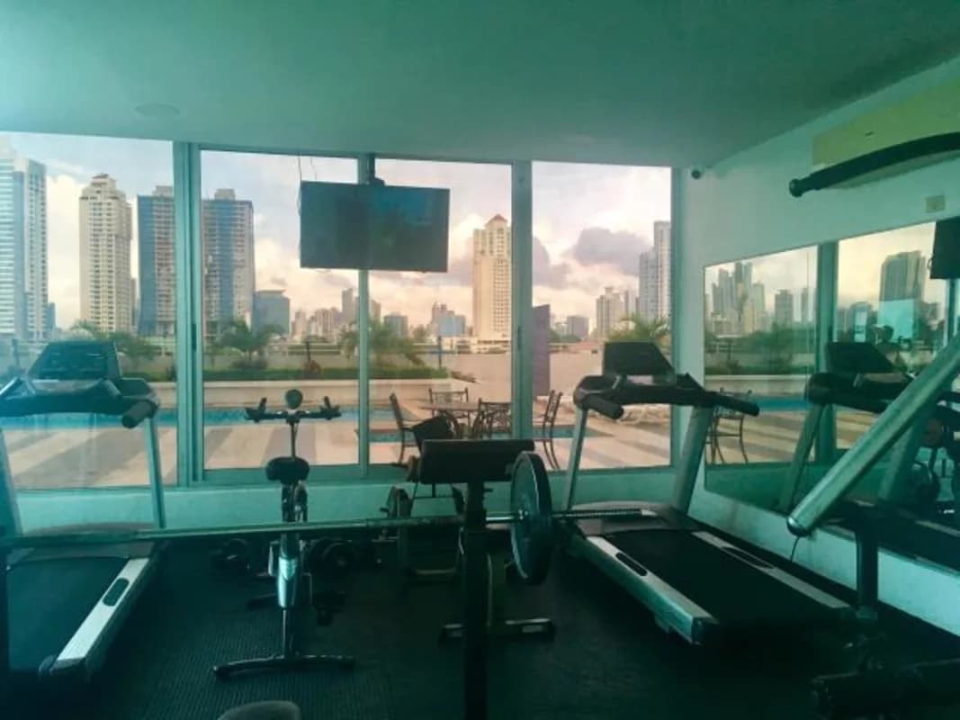 Fitness center with city skyline view at Infinity Tower Panama City