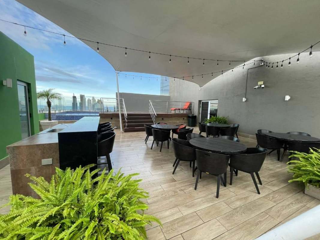 Modern bathroom with beige ceramic tiles, glass shower and granite countertop PH El Cangrejo Terrace