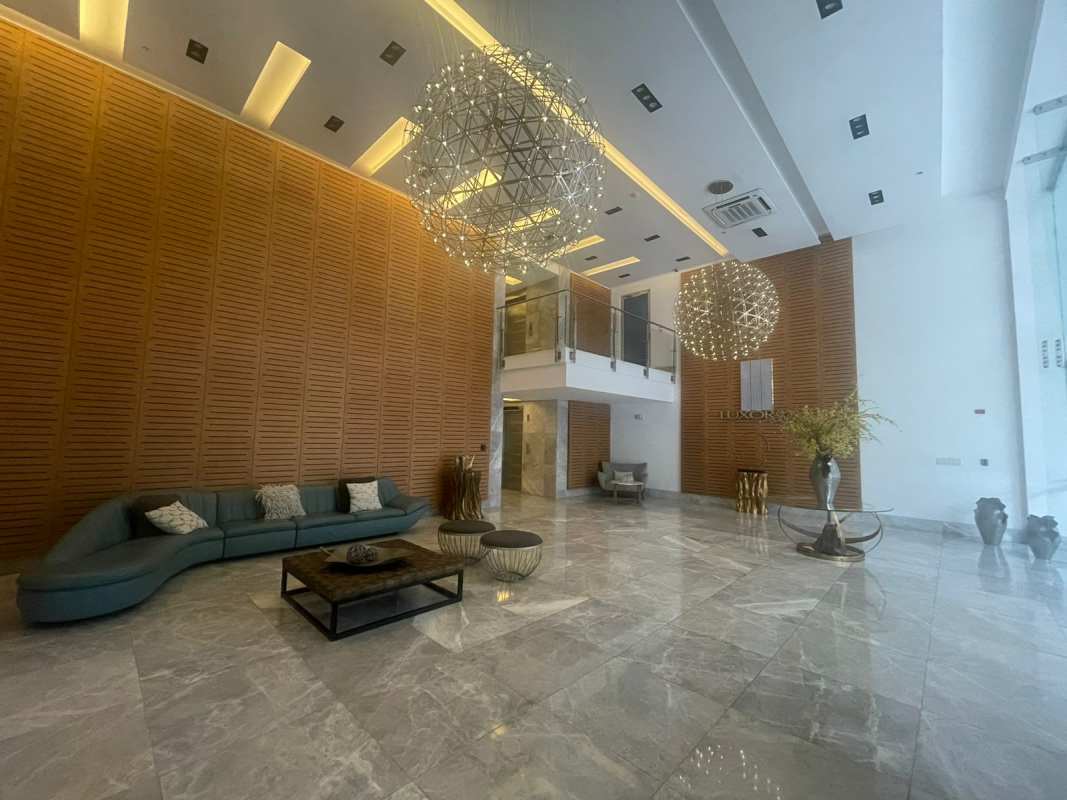 Elegant lobby with wood panel wall and modern design in PH El Cangrejo Terrace Panama City
