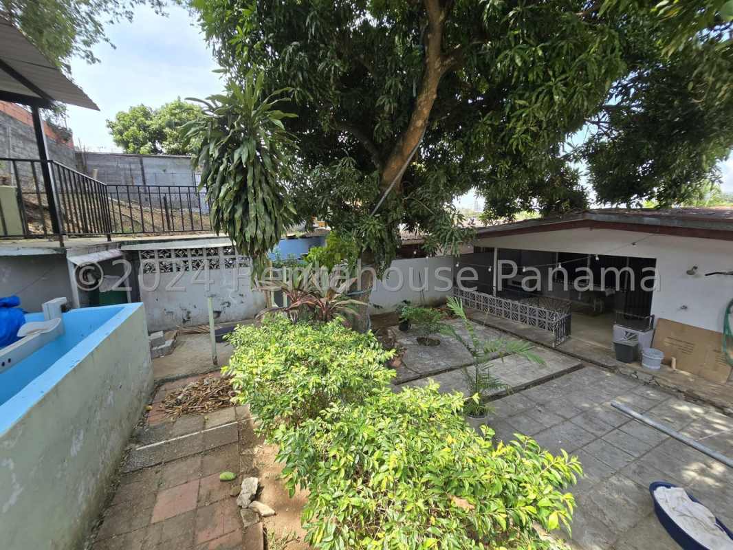 Kitchen with white cabinets, blue countertops, and appliances in Hato Pintado house for sale