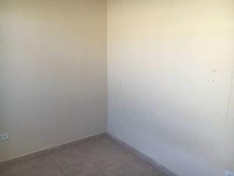 Interior blue accent wall tiled ceiling empty room Villas de La Alameda house