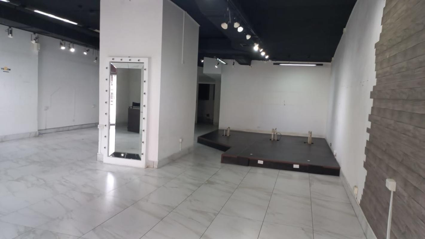 Retail showroom with stage area, illuminated mirror, marble floors on Vía Porras Panama City