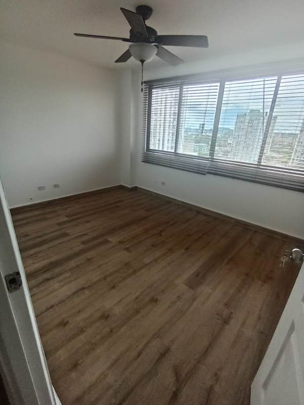Empty bedroom with closet, ceiling fan, laminate wood floors PH La Loma Park Panama