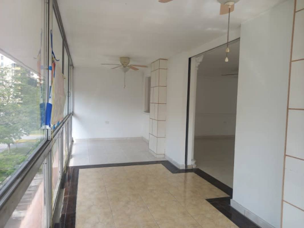 Enclosed balcony with large windows and ceramic floor PH El Cangrejo Via Argentina Panama