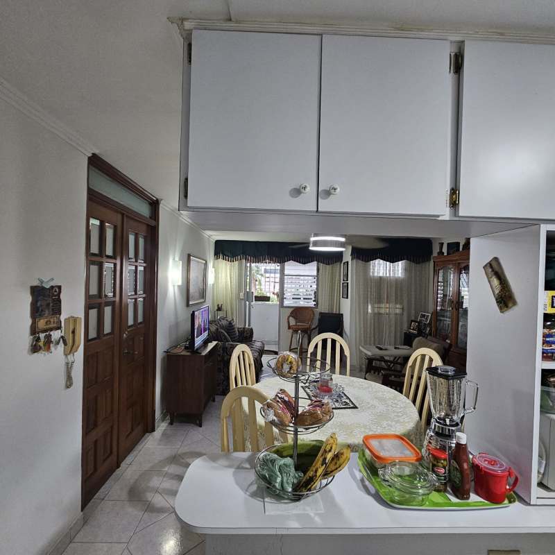 Bedroom with ceiling fan, tile floors and windows at Carrasquilla Residences San Francisco Panama