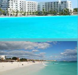 Modern beachfront high-rise condominium building with pools and sandy beach at Playa Blanca Panama