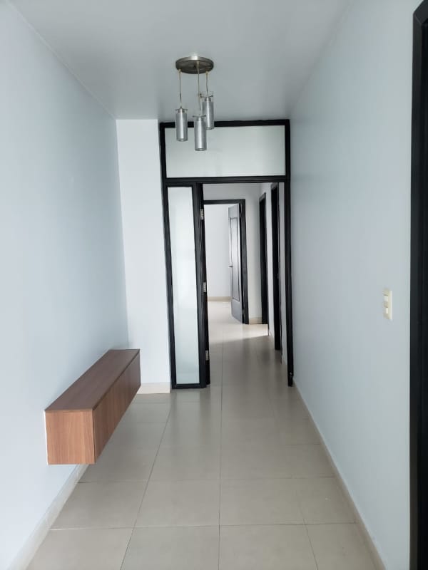 Open kitchen at PH Tao Tower with granite countertops and breakfast bar in San Francisco Panama