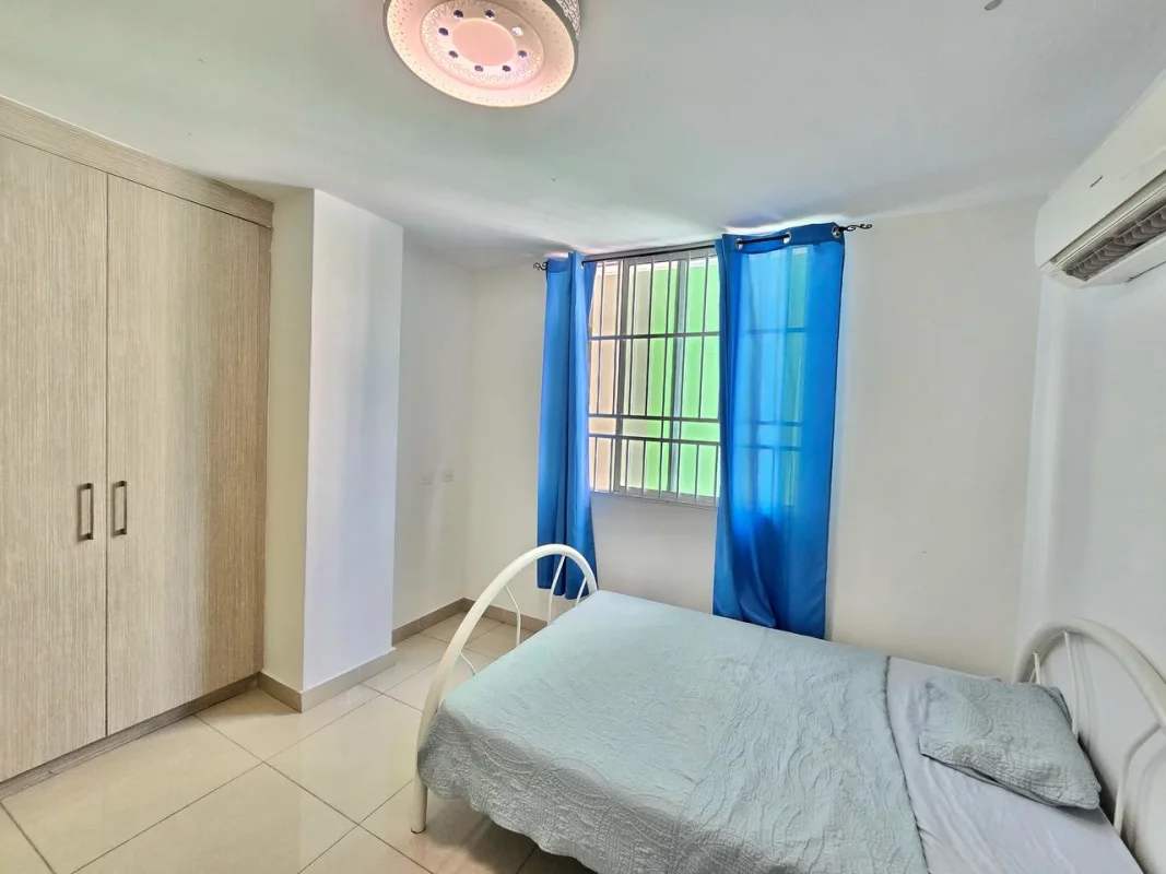 Master bedroom with ensuite bathroom, window views, furnished PH Green Park Panama