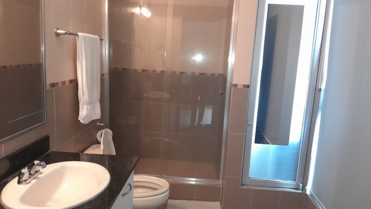 Elegant bedroom with ocean view and walk-in closet in PH Bayfront Tower