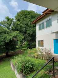 Facade of large two-story house with garden in downtown Santiago, Panama