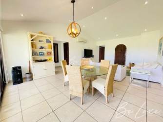 Spacious living and dining room with large windows at Vista Mar Golf Beach Resort Panama