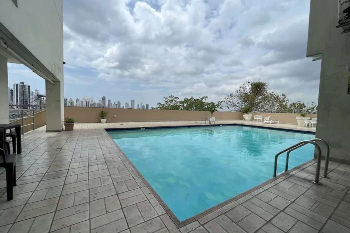 Outdoor swimming pool with skyline views at PH Edison Park Panama City
