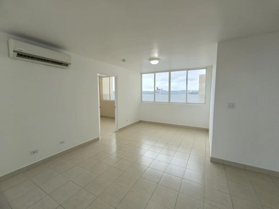 Spacious living room with tiled floors, AC, large window in Edison Park Panama apartment for rent