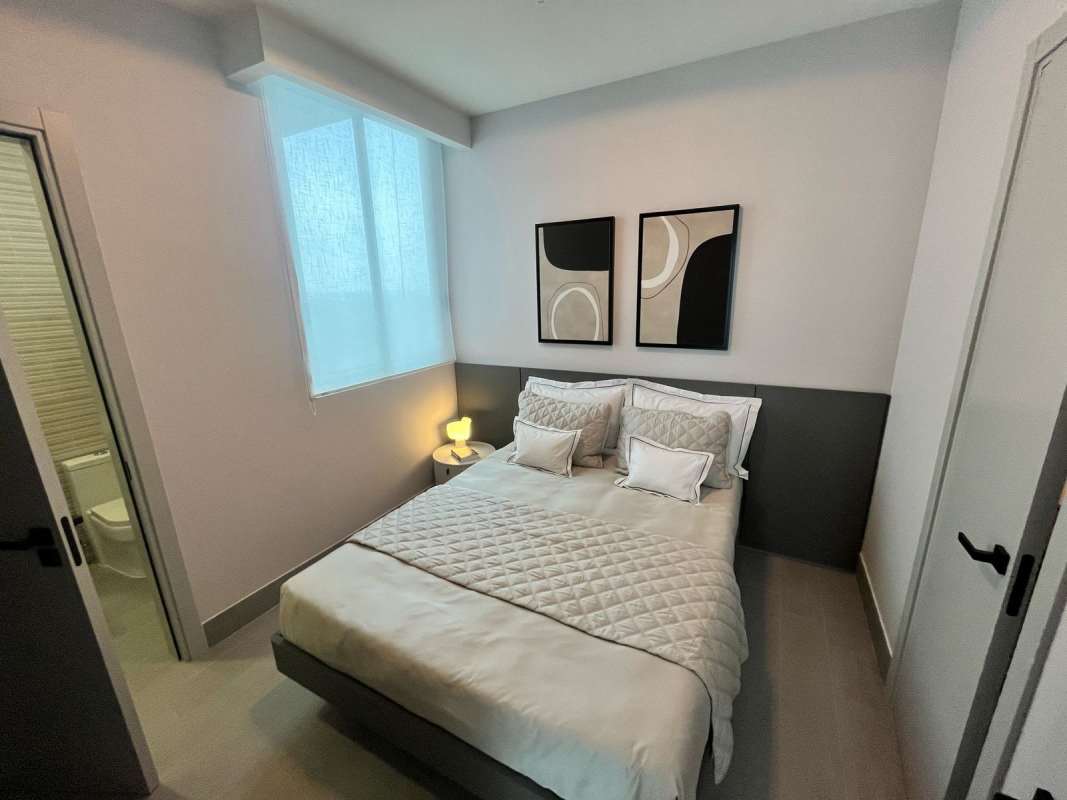 Contemporary kitchen with marble counters, island, stainless appliances The Ivy Panama