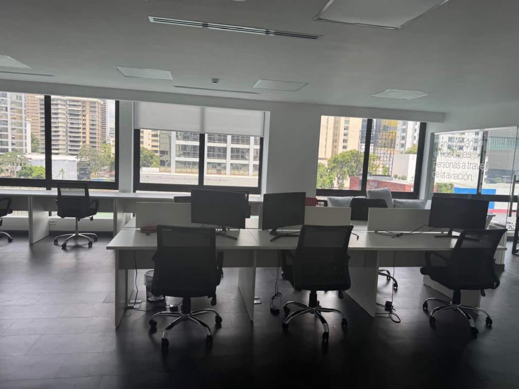 Bright team workspace with glass walls and panoramic windows in Torre Versatec Calle 50 Panama