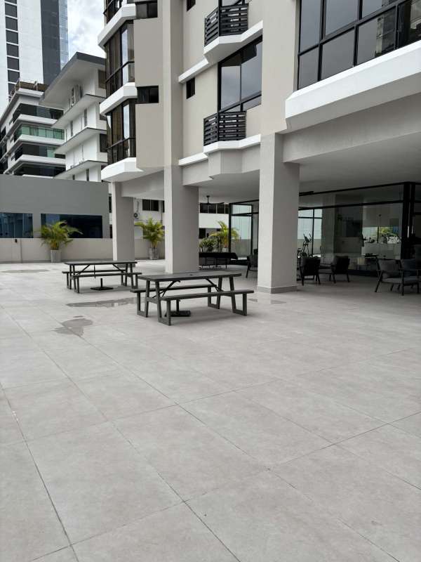 Modern pool area with lounge chairs PH Millennium Obarrio