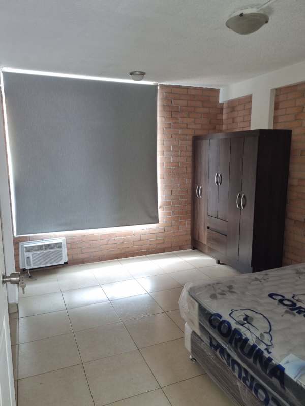 Traditional bathroom with shower, sink, and tile walls in PH Multicentro Plaza Panama