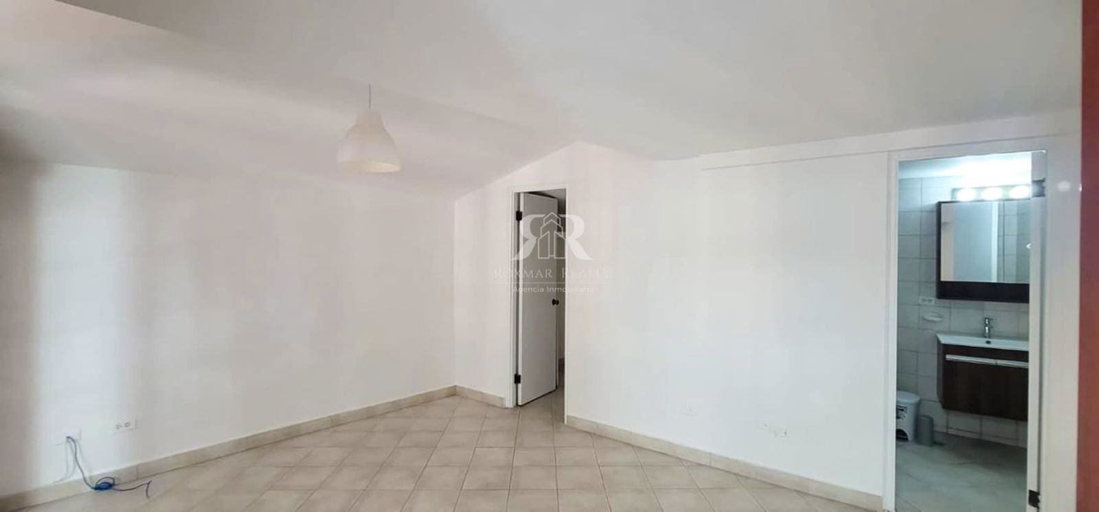 Interior living room with adjacent bathroom in Panama historic apartment