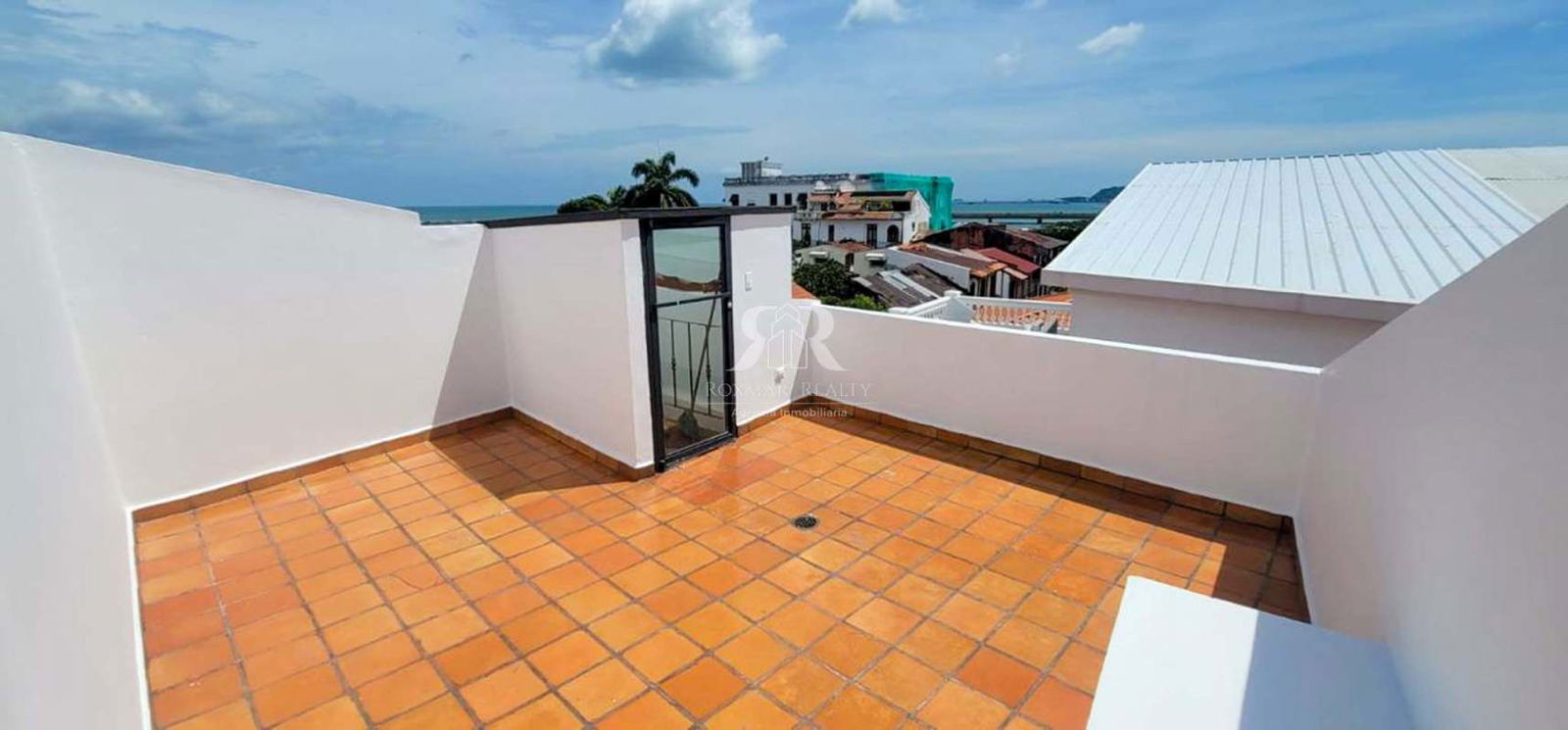 Living room with large french doors and AC in Casco Viejo apartment Panama City